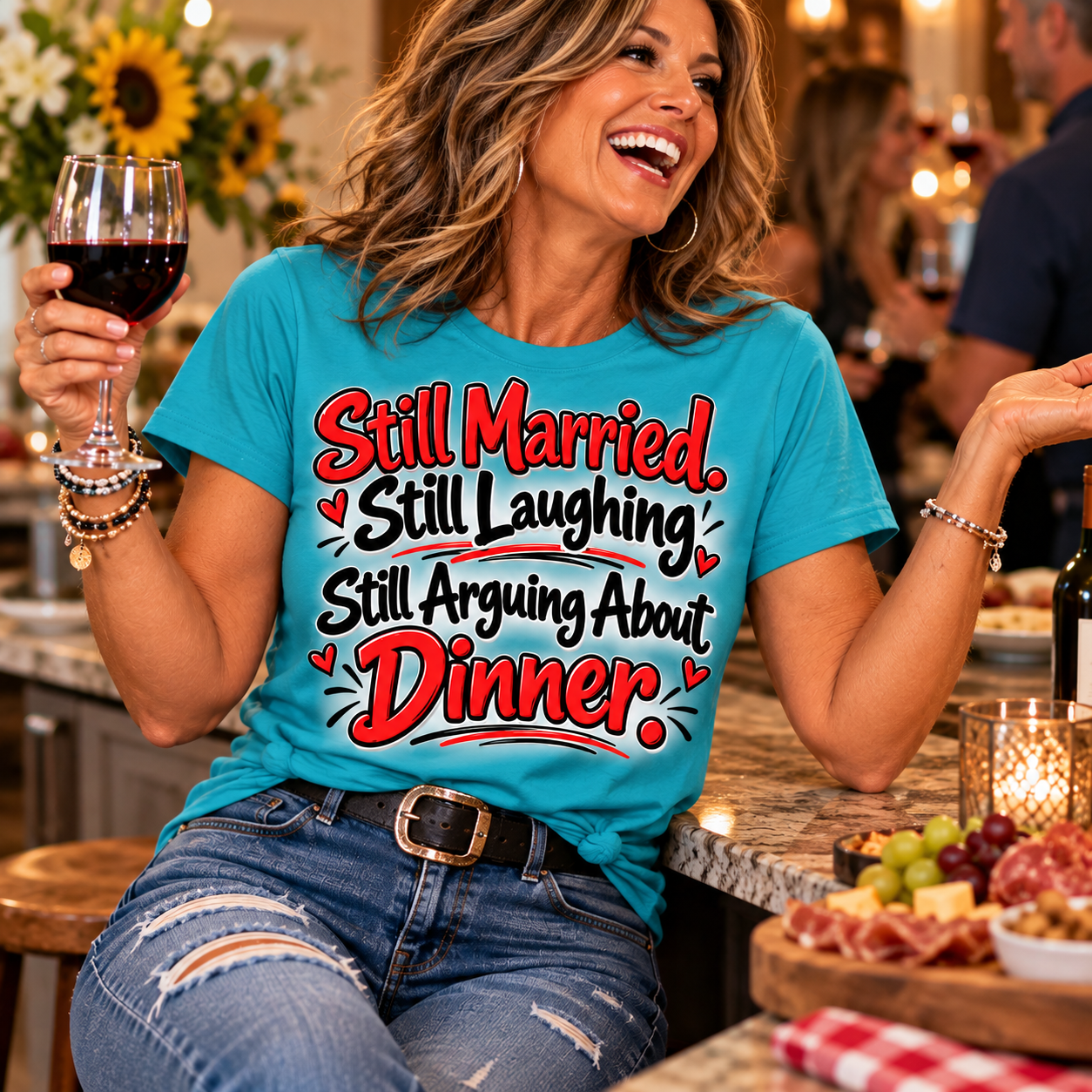 A laughing woman holding wine and wearing a turquoise Still Married, Still Laughing, Still Arguing About Dinner T-shirt